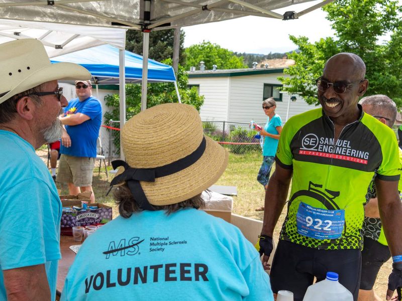 Samuel Engineering's CEO, Everod Samuel participating in community charity called Bike MS and talking with volunteers and showing off Samuel's culture of helping the community.